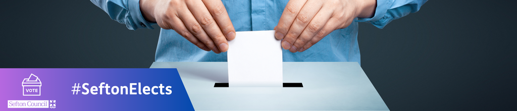 An image of a man putting a ballot paper in a box
