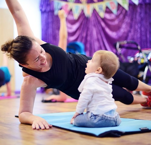 Mum exercising with her baby