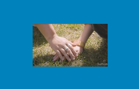 Two hands with one wearing 999 ReUnite Wristband