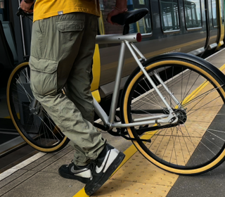 A bike being pushed onto a merseyrail train