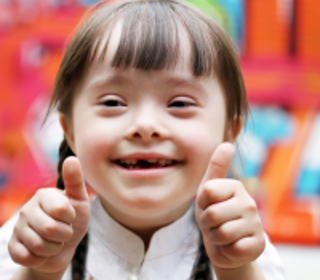 Smiling girl with downs syndrome 