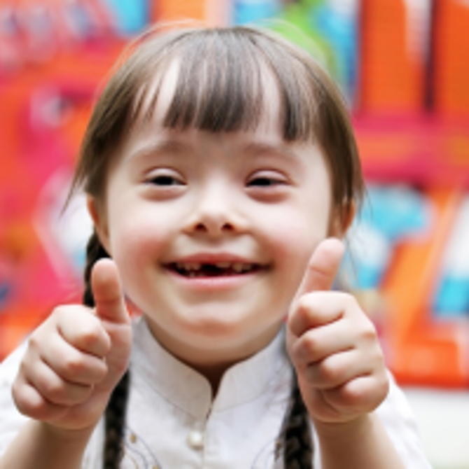 Smiling girl with downs syndrome 