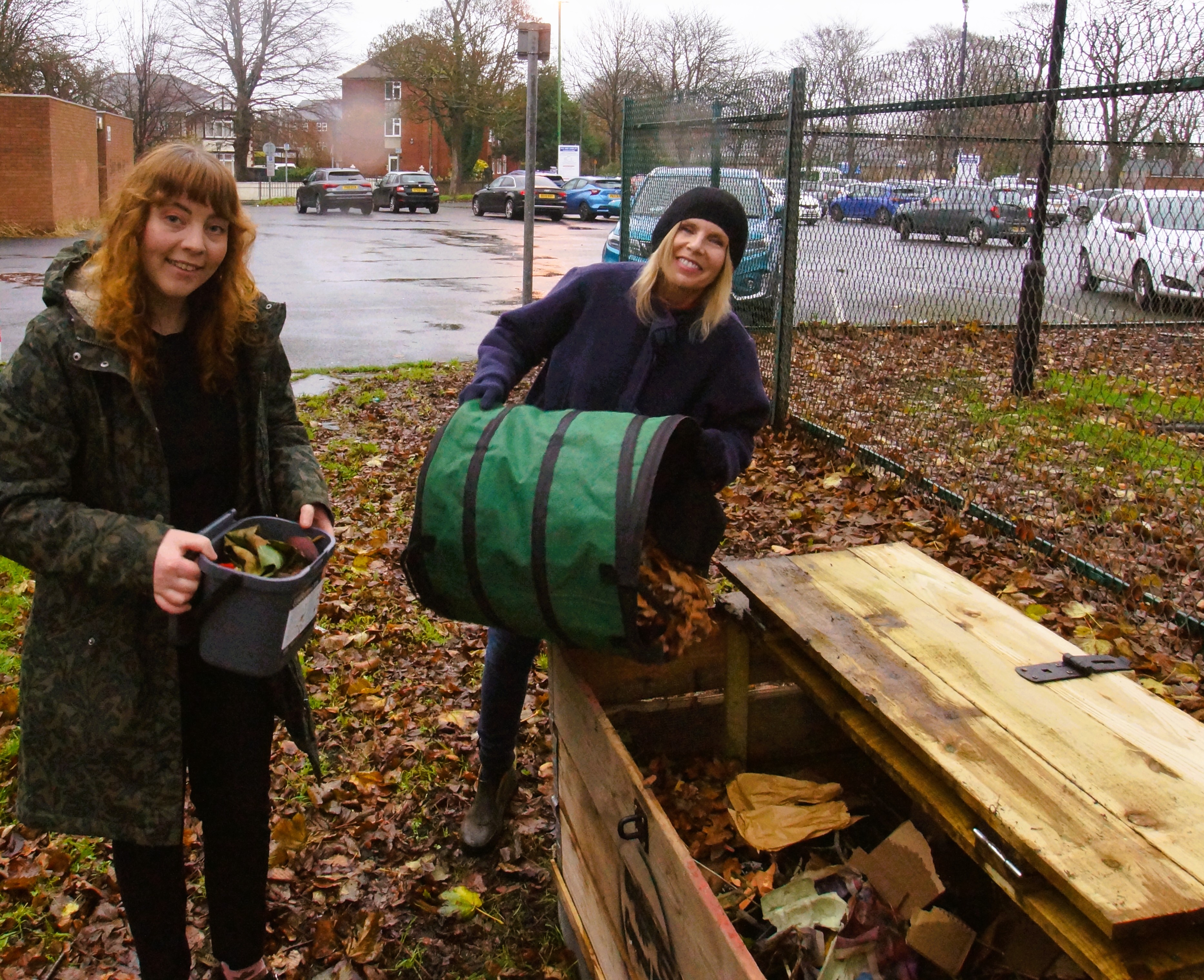 Pictured are Libraries' Erin Connolly, who is leading the Community Composting scheme and  Cllr Liz Dowd topping up one of the bins.