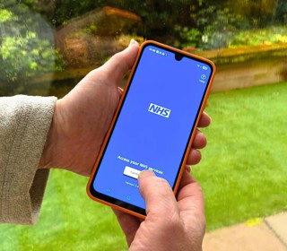 Person using the NHS App on a mobile phone