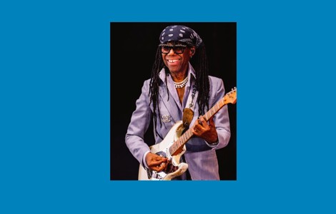 Nile Rodgers playing the guitar