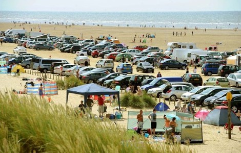 Cars parked on beach