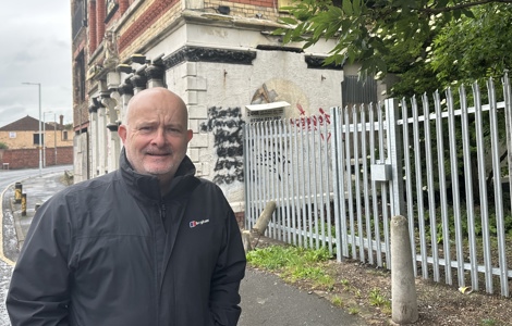 Councillor Peter Harvey, Cabinet Member for Cleansing and Street Scene at site of secure fence. 